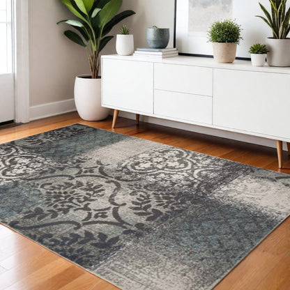 4' X 6' Teal And Ivory Damask Distressed Area Rug