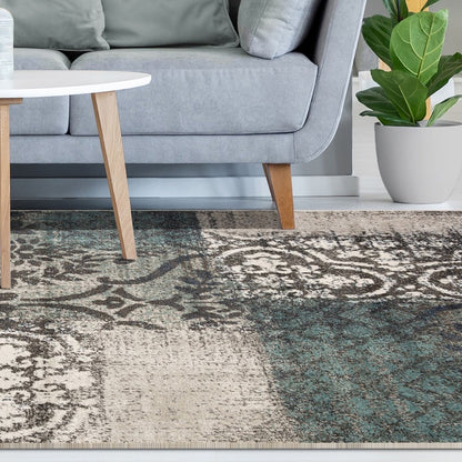 5' X 8' Teal And Ivory Damask Distressed Area Rug