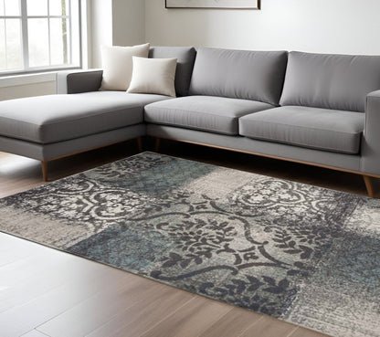 8' X 10' Teal And Ivory Damask Distressed Area Rug