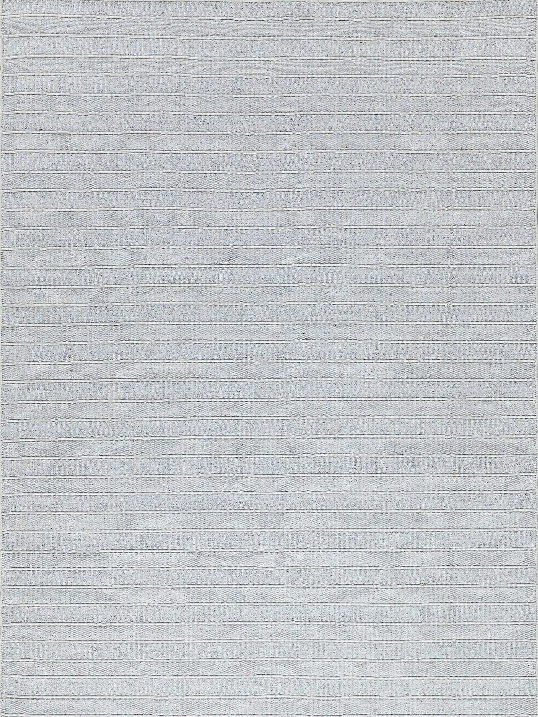Light gray woven rug with subtle horizontal stripes and soft, textured surface.