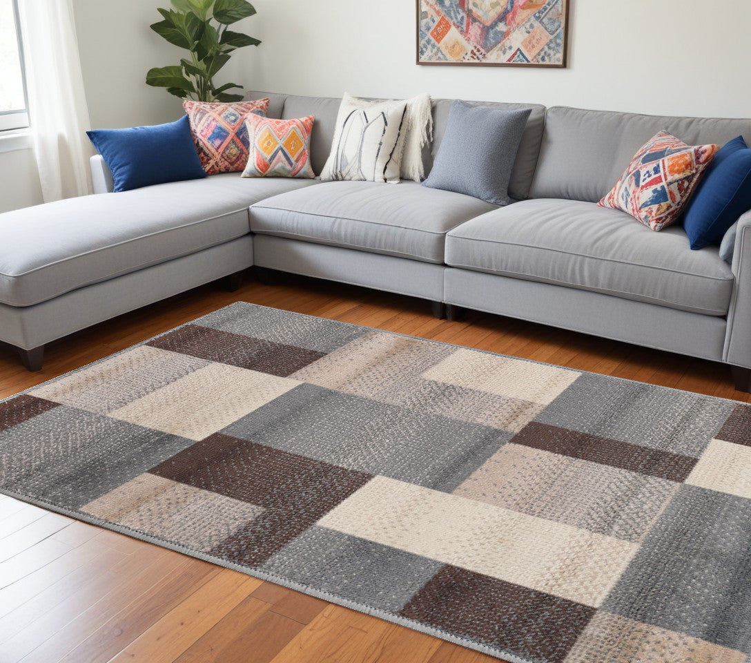 6' X 9' Gray Brown and Cream Patchwork Area Rug