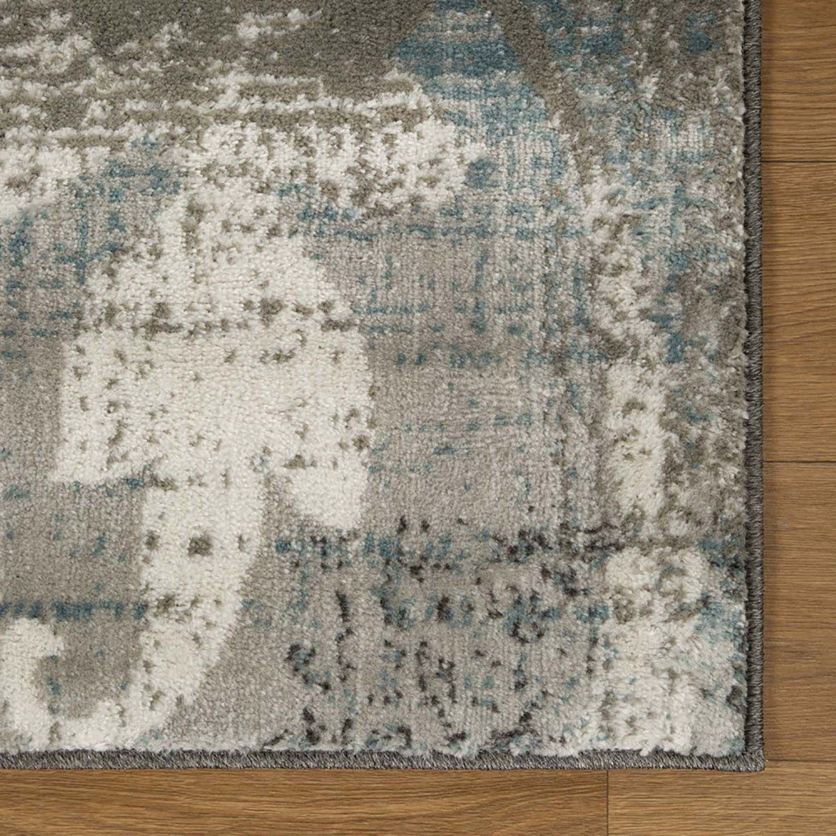 5' X 8' Teal Gray And Tan Floral Power Loom Distressed Stain Resistant Area Rug