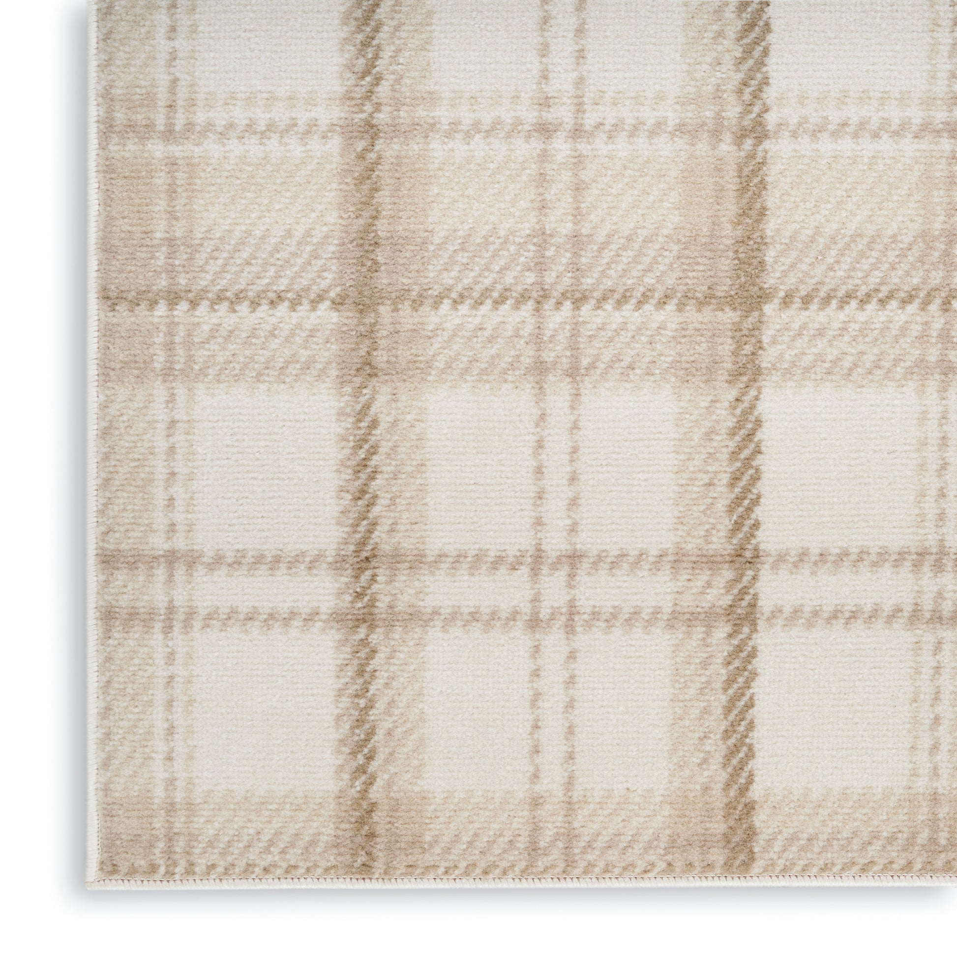 Rectangular beige plaid rug with soft woven texture in cream and tan tones.