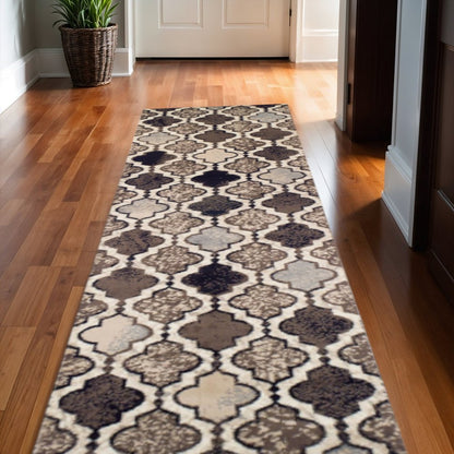 11' long ivory, brown and black quatrefoil distressed runner rug