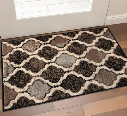 2' X 3' Brown Black And Ivory Quatrefoil Distressed Area Rug