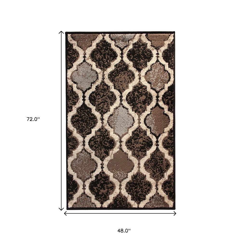 4' X 6' Brown Black And Ivory Quatrefoil Distressed Area Rug