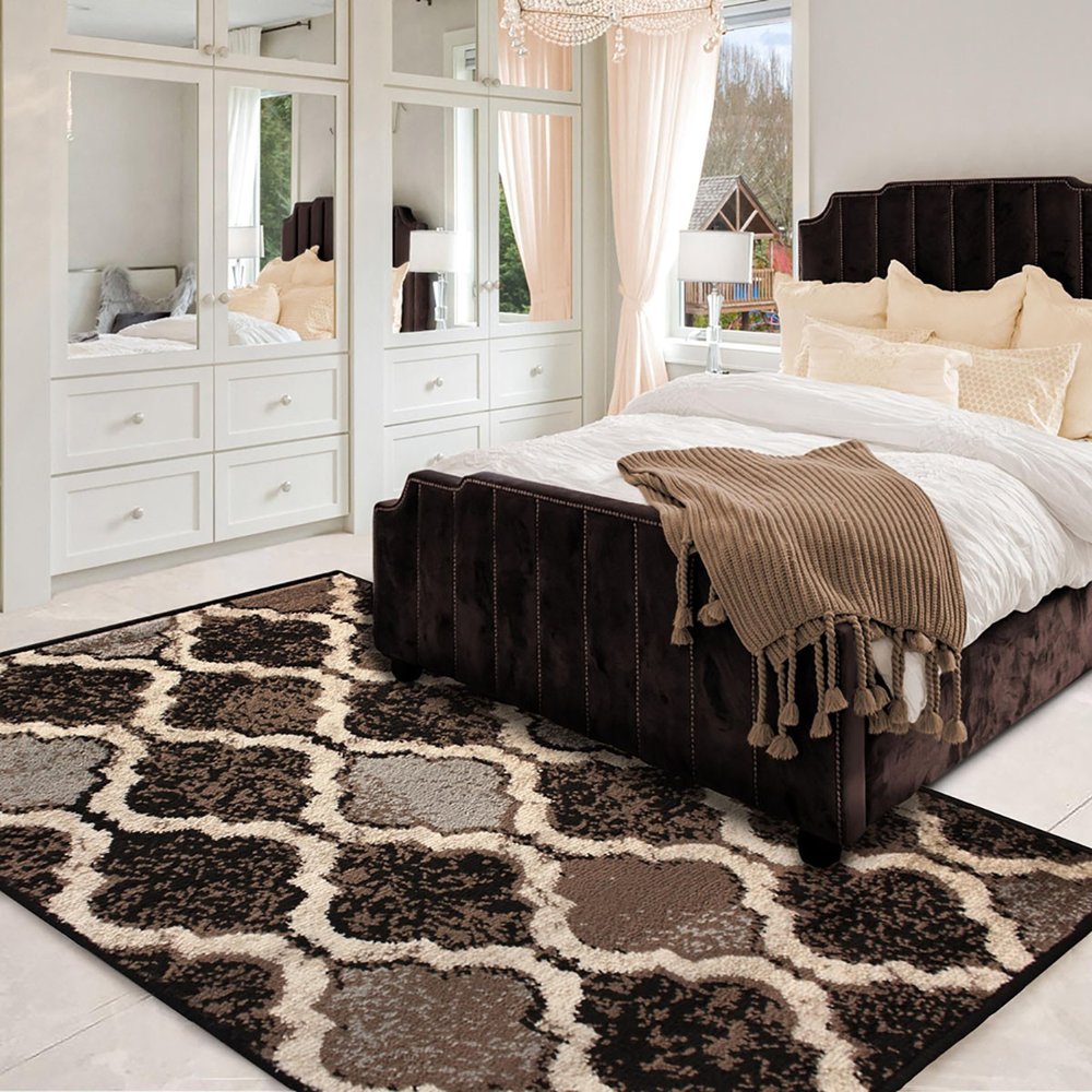 5' X 8' Brown Black And Ivory Quatrefoil Distressed Area Rug