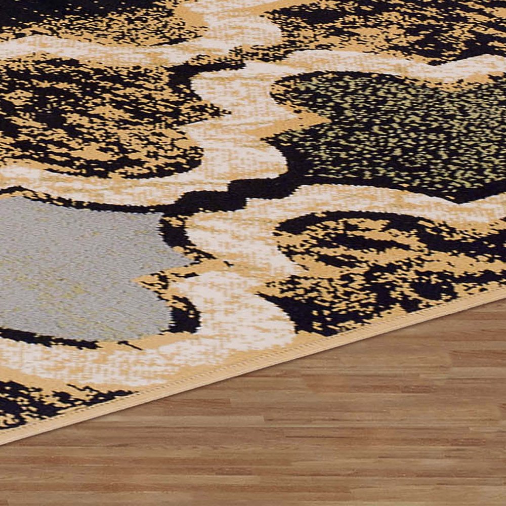 5' X 8' Black And Ivory Quatrefoil Distressed Area Rug