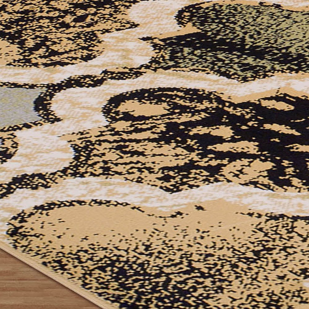 5' X 8' Black And Ivory Quatrefoil Distressed Area Rug