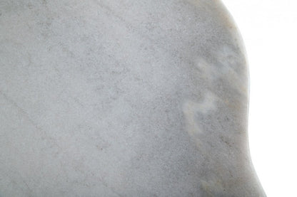 Close-up of light gray marble texture with subtle veining and a rounded edge.