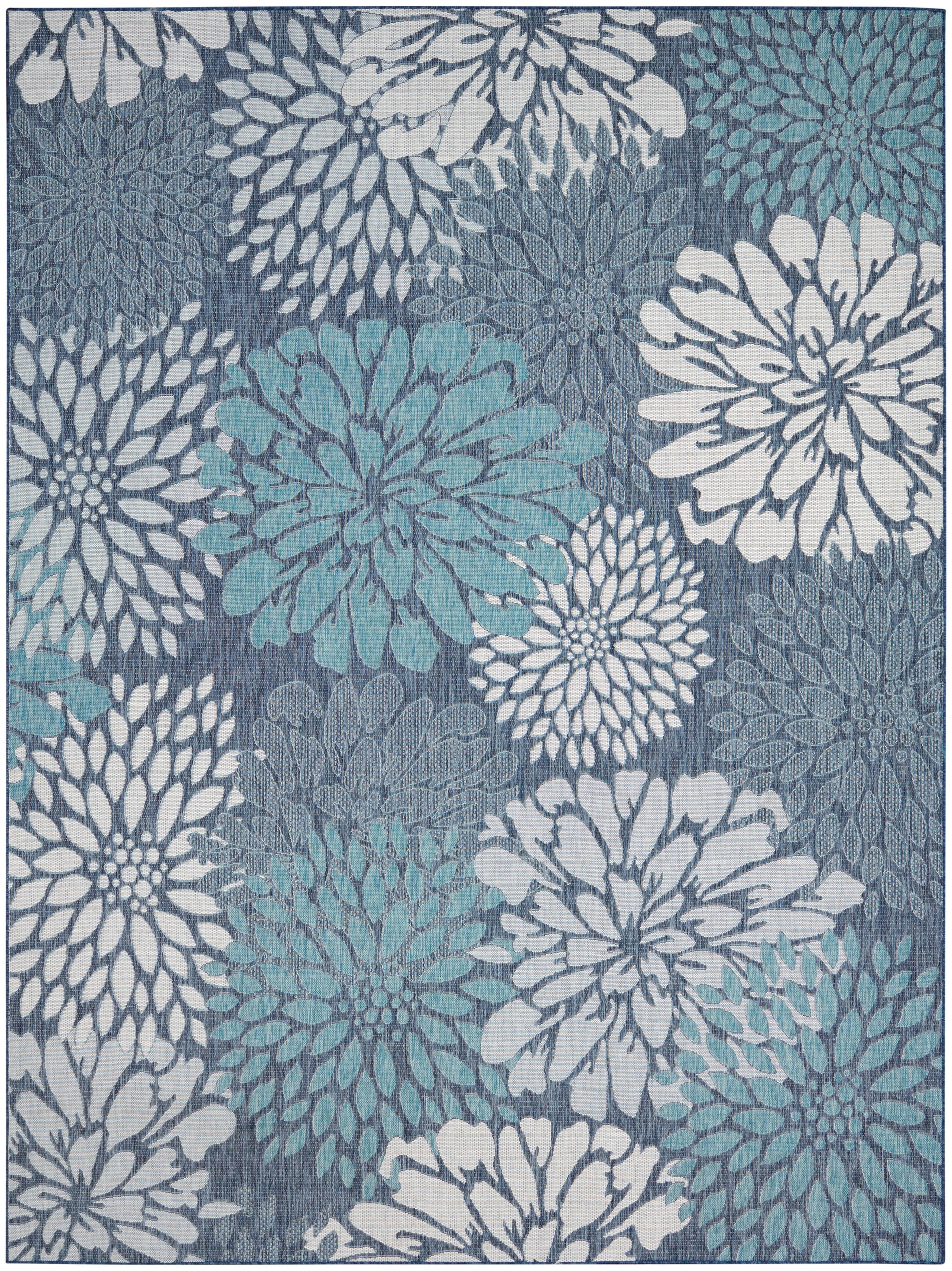 Blue-gray rug featuring large white and teal chrysanthemum-style flowers in a repeating pattern.