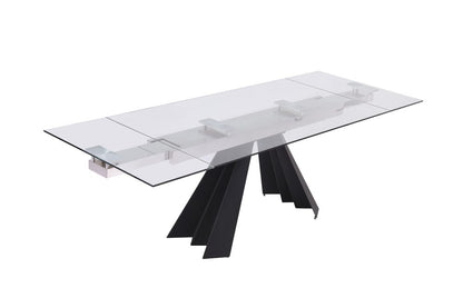Rectangular clear glass dining table with a sculptural black angular pedestal base, modern contemporary style.