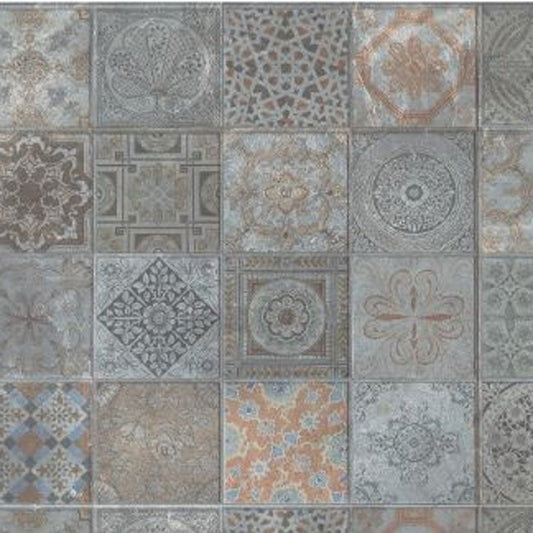 Square ceramic tiles in a vintage patchwork pattern with arabesque and geometric motifs in muted blue gray and beige.