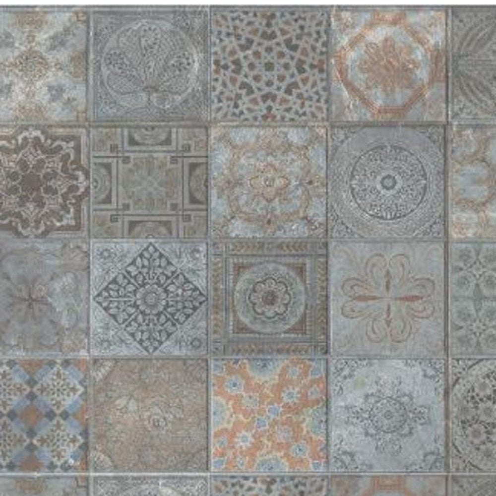 Assorted ceramic tiles with floral and geometric patterns in muted blues, grays, and browns.