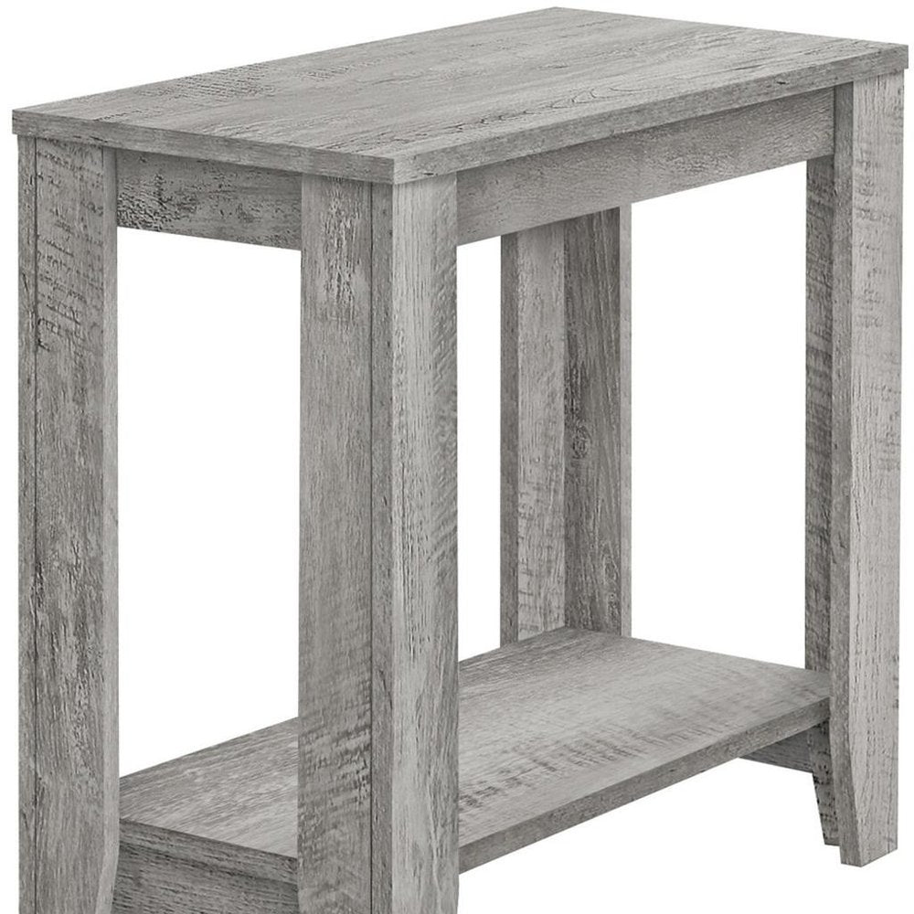 Rustic weathered gray wood end table with rectangular top, lower shelf and chunky legs.