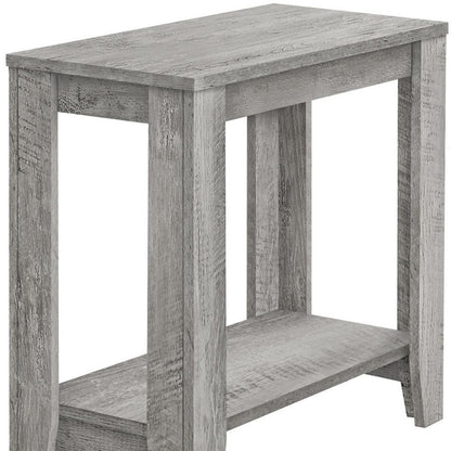 Rustic weathered gray wood end table with rectangular top, lower shelf and chunky legs.