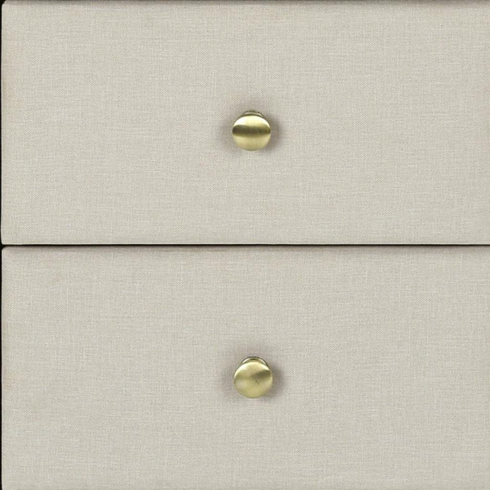 Beige linen-style dresser with two drawers and brass round knobs.