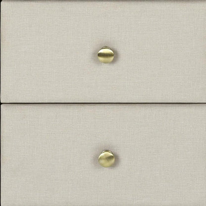 Beige linen-style dresser with two drawers and brass round knobs.