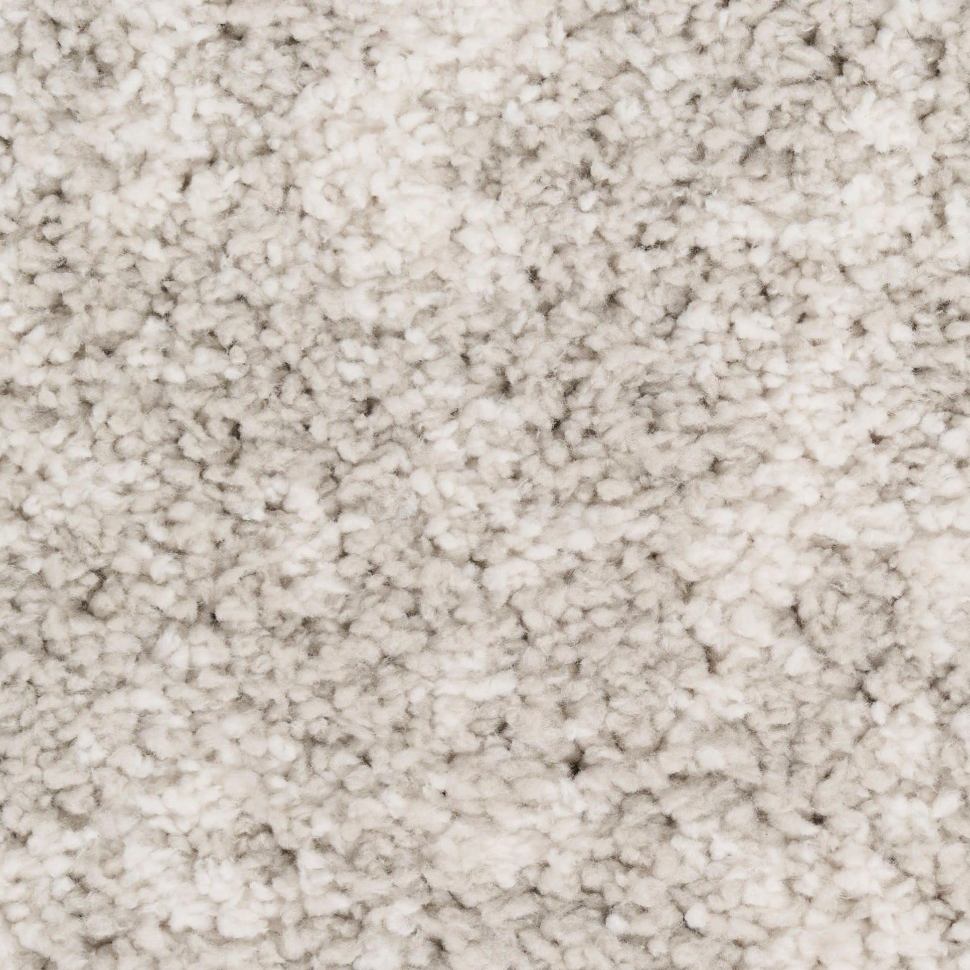 Cream-beige plush carpet close-up with dense, soft pile; cozy living room rug.