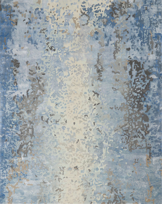 Rectangular abstract area rug in blue, cream and taupe with distressed pattern; soft, modern decor accent.