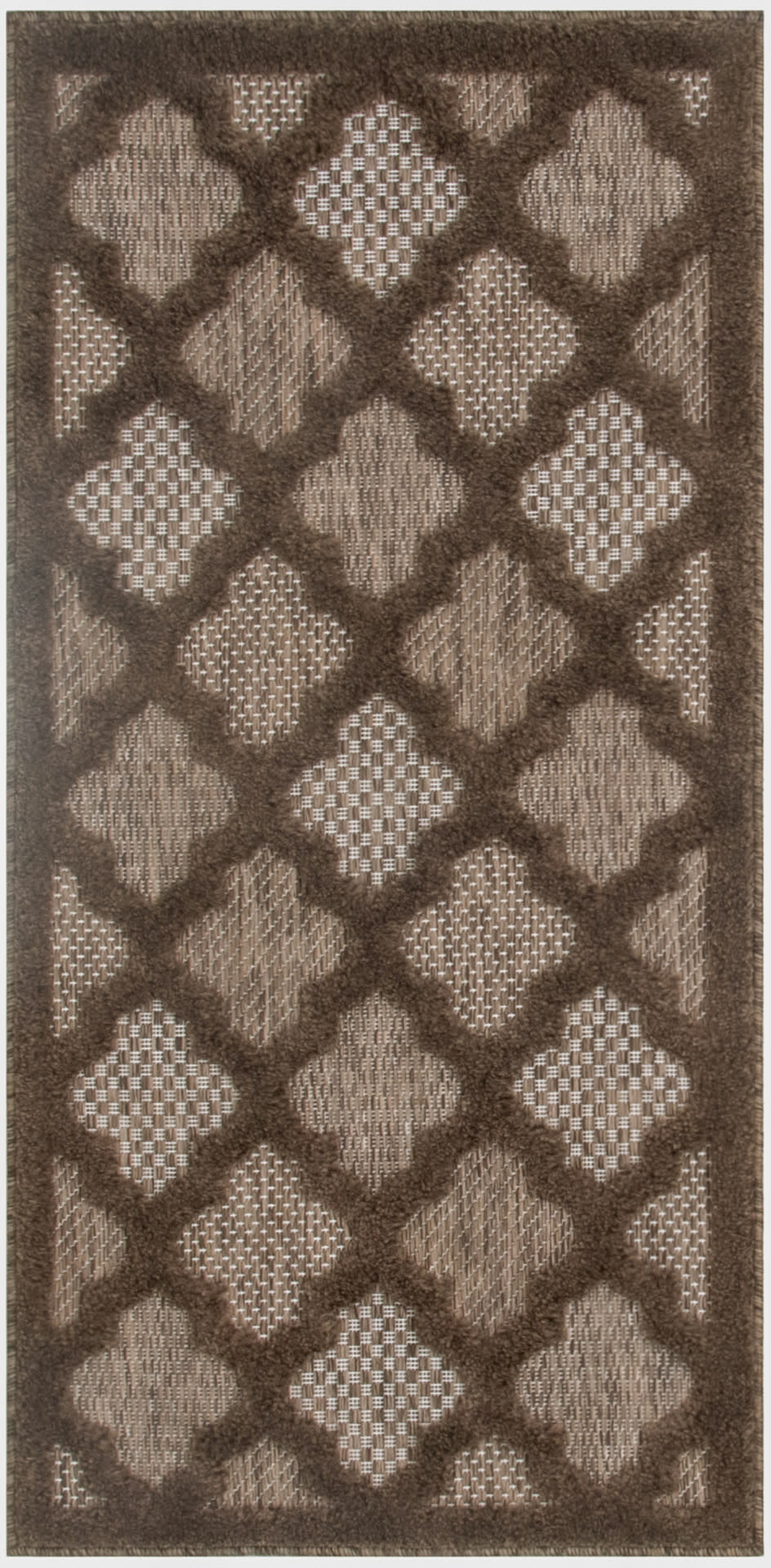 Brown rectangular shag rug with dark brown diamond lattice pattern and tan woven centers; plush tufted pile.