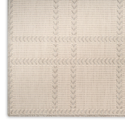 Beige textured woven plaid rug with taupe grid lines; soft cotton blend, bath rug or floor mat.