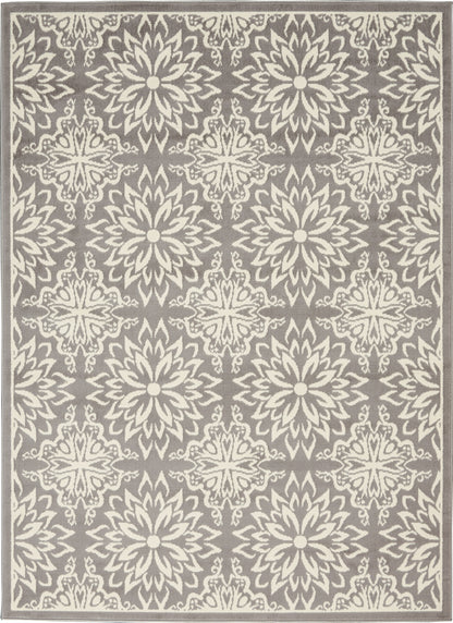 Gray area rug featuring repeating ivory floral medallions in a damask-inspired pattern with a subtle border.