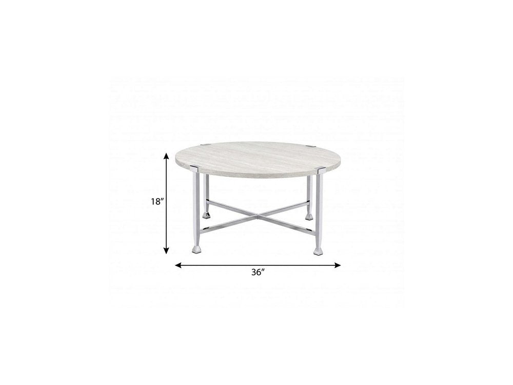 Round coffee table with white and silver metal cross legs, 36in dia, 18in high.