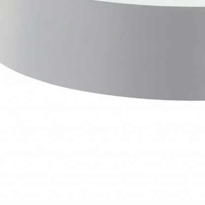 32-inch round coffee table with white top and natural wood legs, solid wood construction.