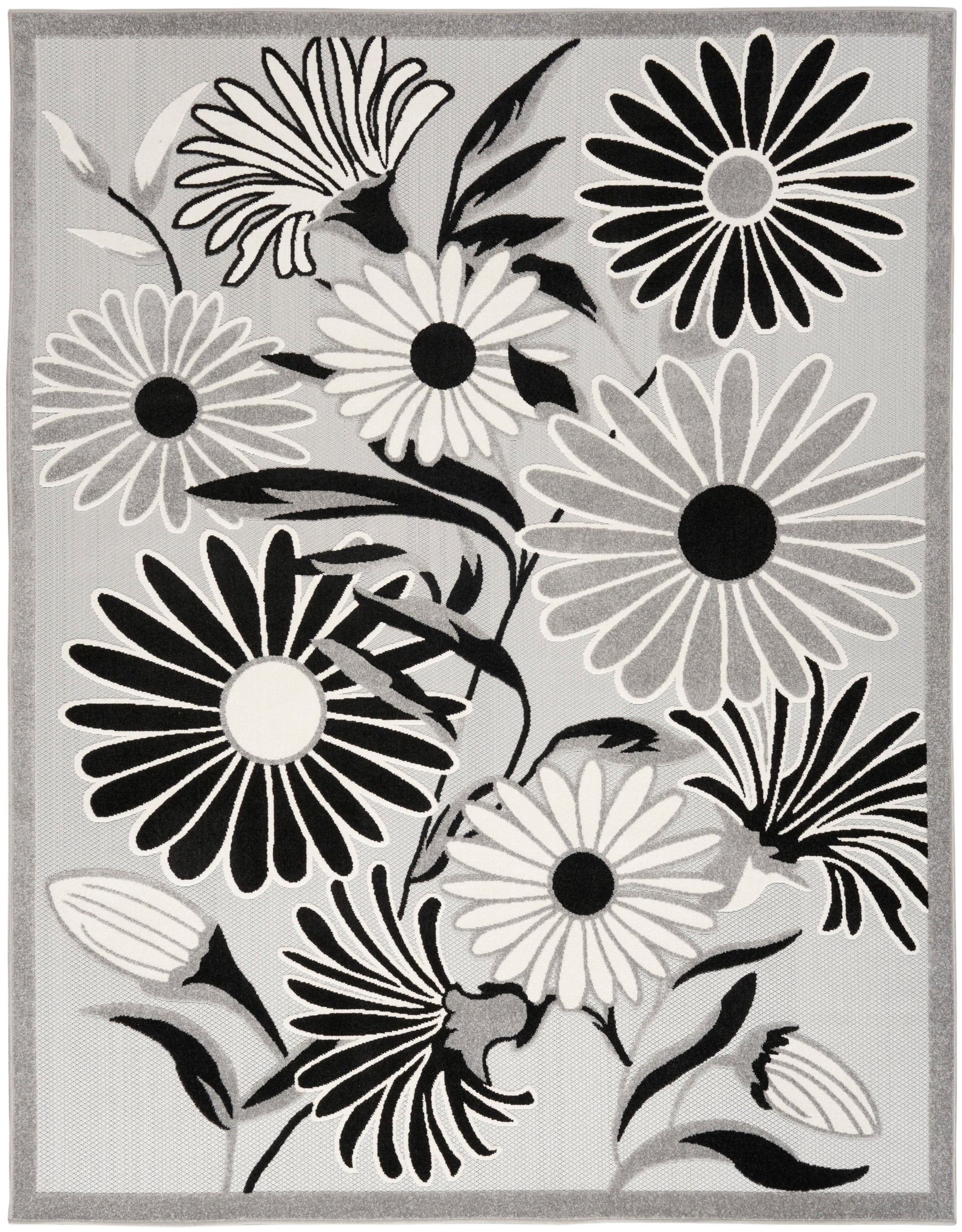 Grey floral area rug with large black, white and gray daisy blooms and a light border.