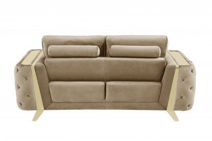 Beige velvet sofa with gold legs, 90 inches long.