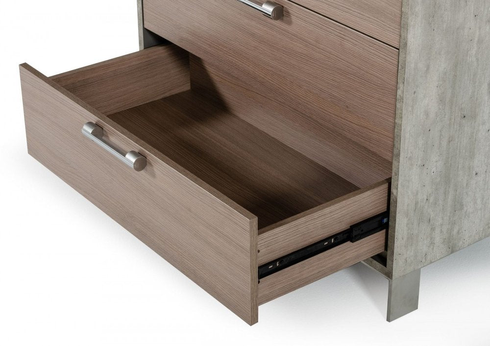 Modern wood dresser with concrete gray side panel; bottom drawer open & metal bar handle.