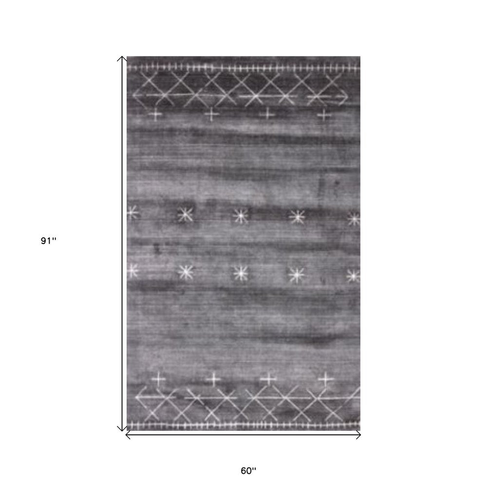 Gray rectangular rug, 91 x 60 inches, white star motifs with a geometric border along edges