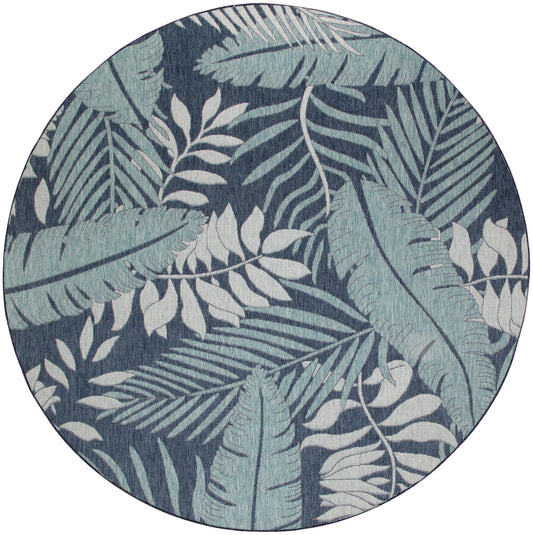 Round rug with blue tropical leaves on a dark navy background.