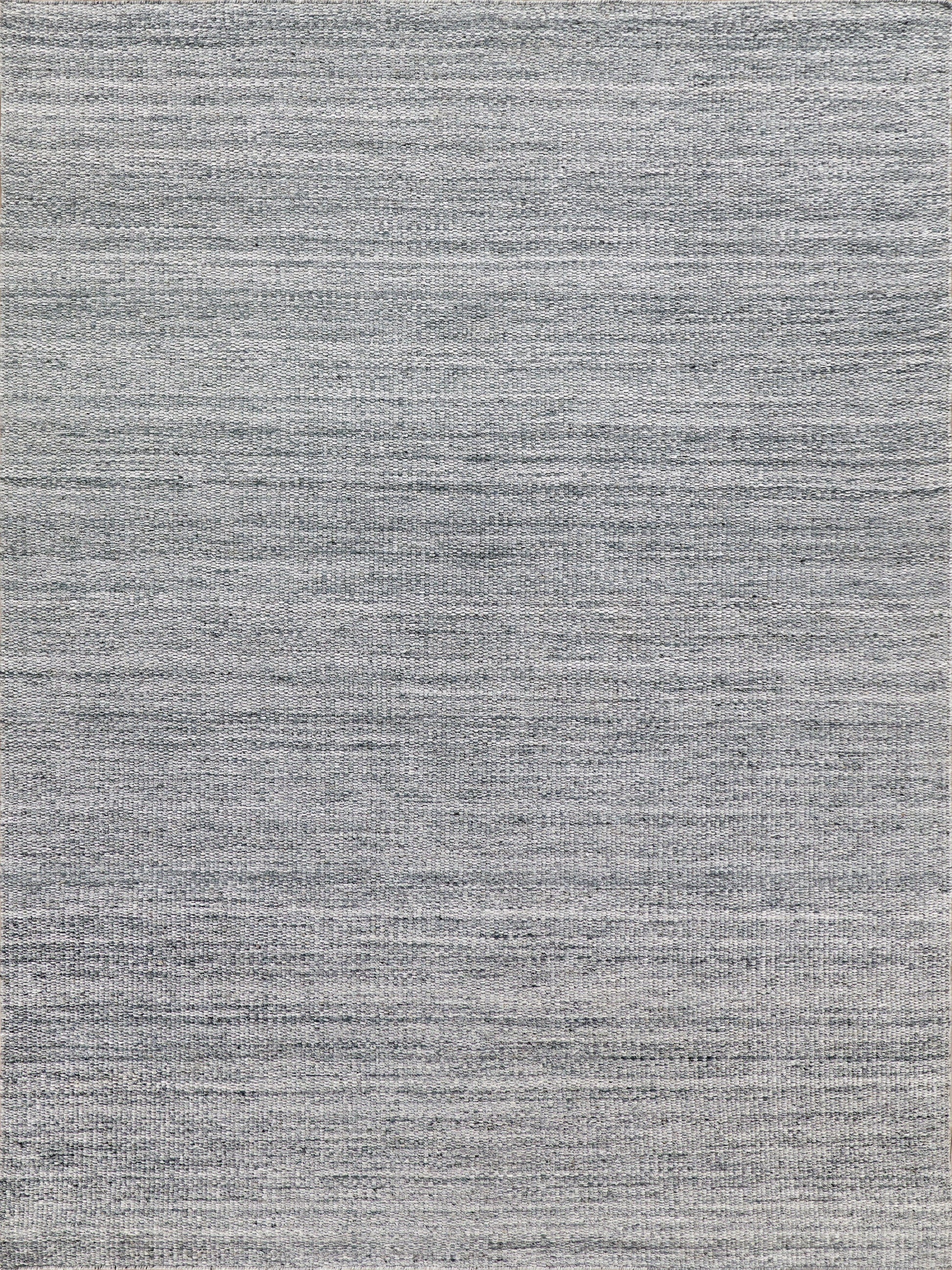 Grey woven area rug with subtle heather texture for modern living rooms.