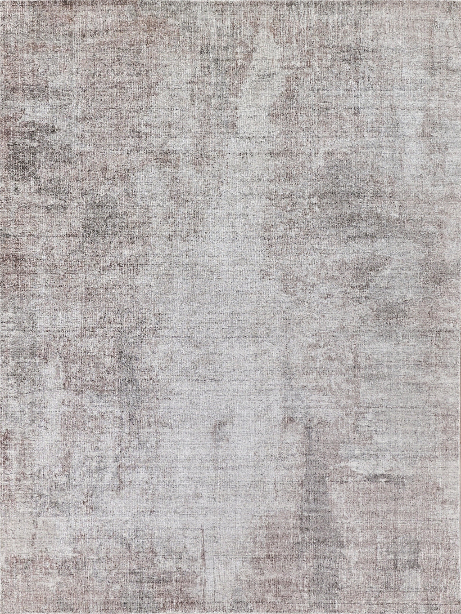 Neutral-toned abstract distressed rug with gray and beige mottled pattern and soft texture.