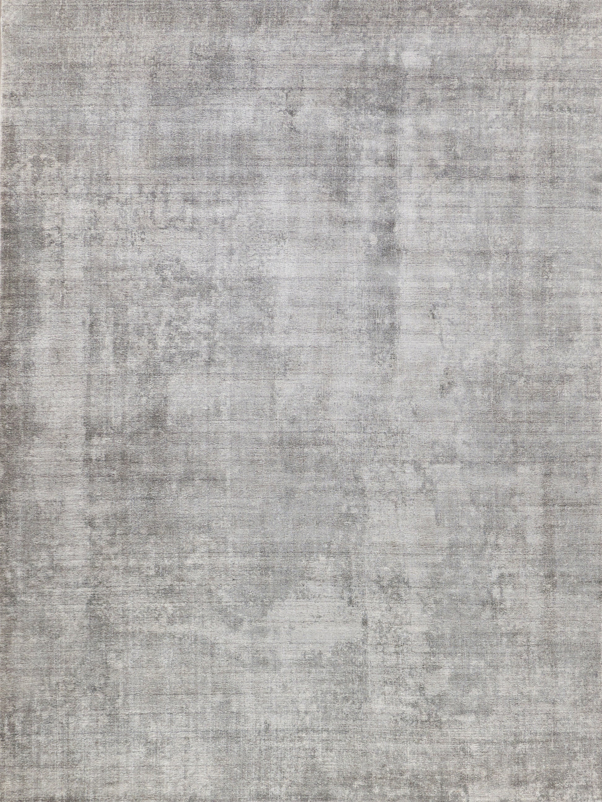 Gray distressed-texture rug with a muted mottled pattern and soft woven surface.