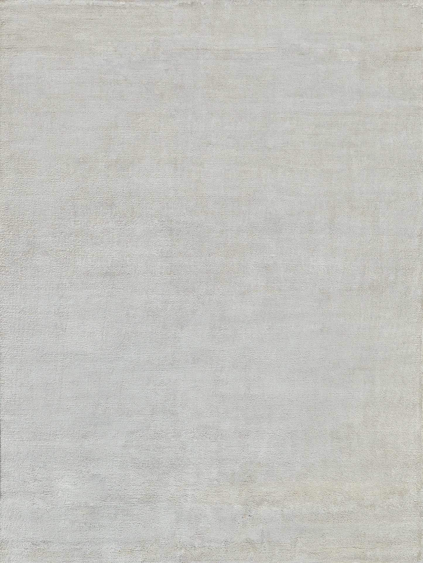 Light gray plush hand-knotted rug with a soft woven texture; indoor use, 2' x 3'.