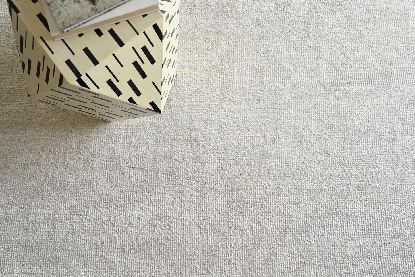 Beige plush indoor hand-knotted rug, 2' x 3'.