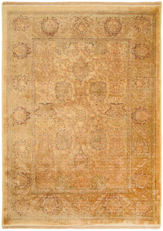 Antique-style gold and beige oriental rug with central floral medallion, ornate border and fringed edges.