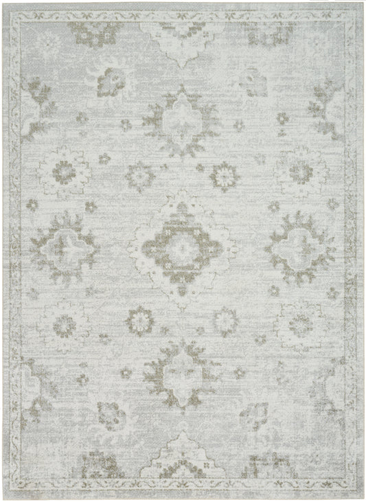 Soft gray area rug with faded ivory damask motifs and ornate border.