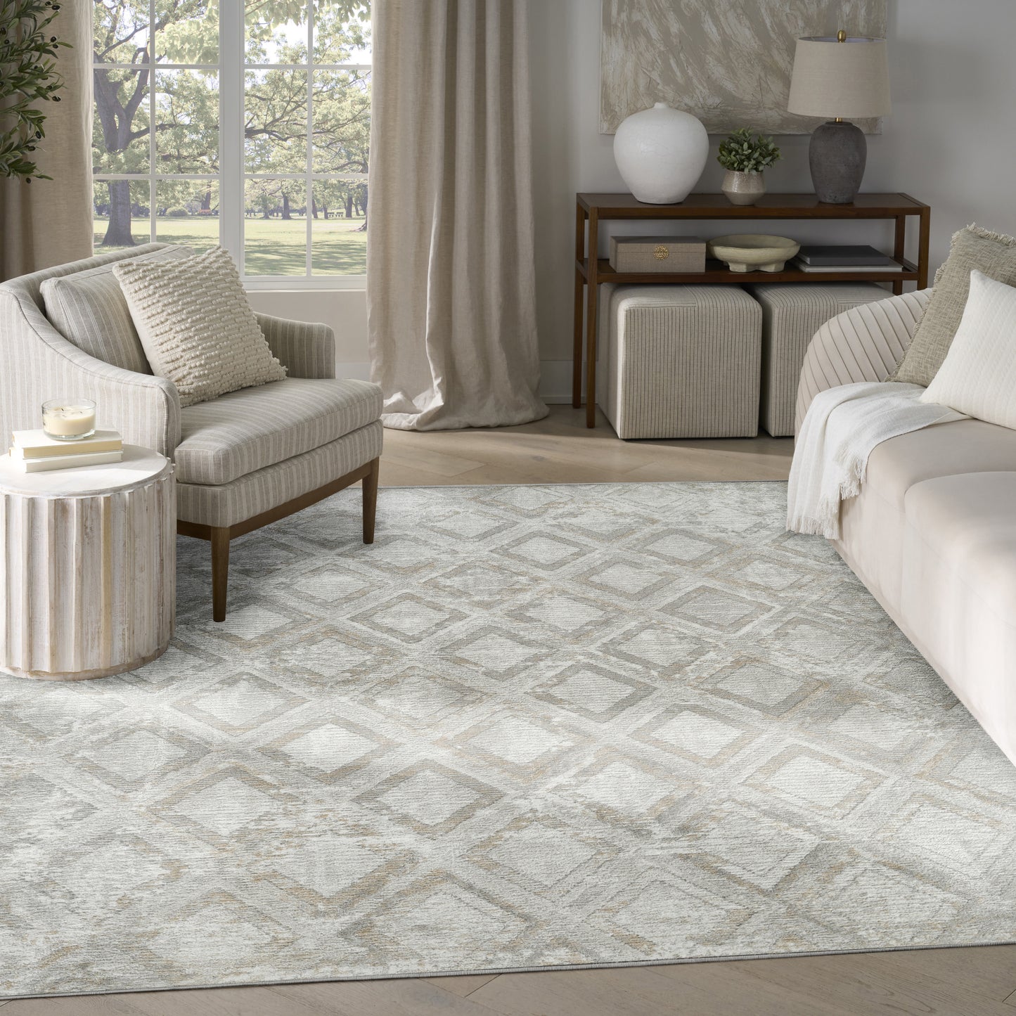 Neutral geometric diamond area rug in beige-gray tones, ideal for modern living rooms with cream sofa and wood accents.