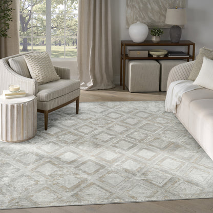 Neutral geometric diamond area rug in beige-gray tones, ideal for modern living rooms with cream sofa and wood accents.