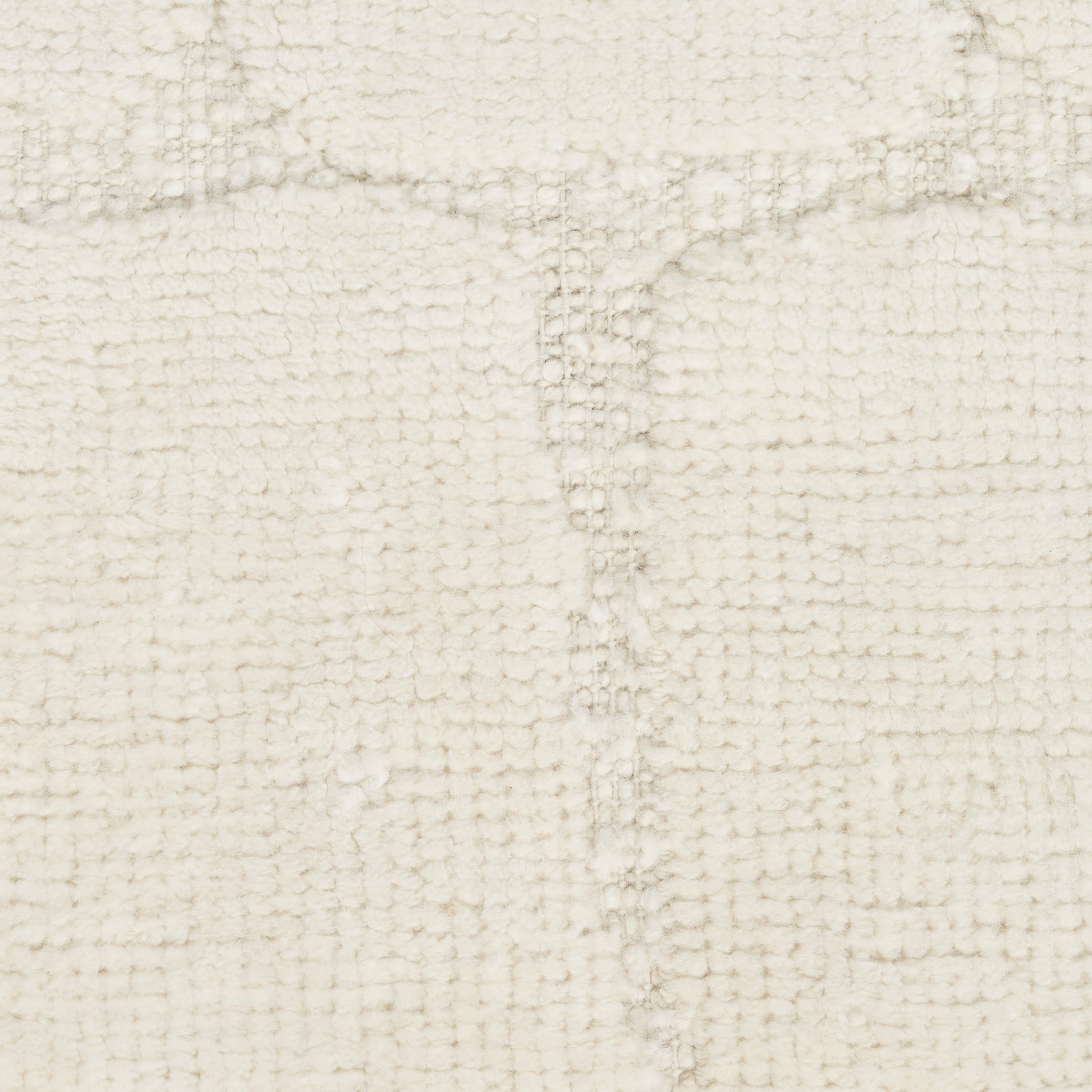 Cream textured boucle rug with a subtle grid pattern; plush, neutral decor for living room or bedroom.