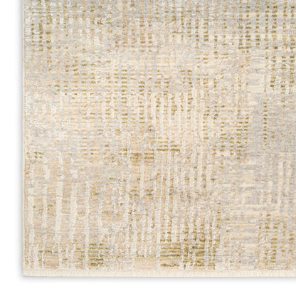Rectangular beige and cream abstract textured area rug with fringe along the bottom edge.