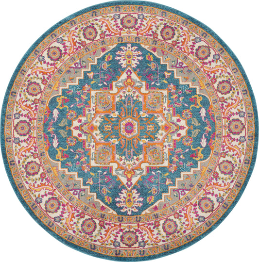 Round Persian-style rug with teal center, intricate multicolor floral medallion; pink & gold border.
