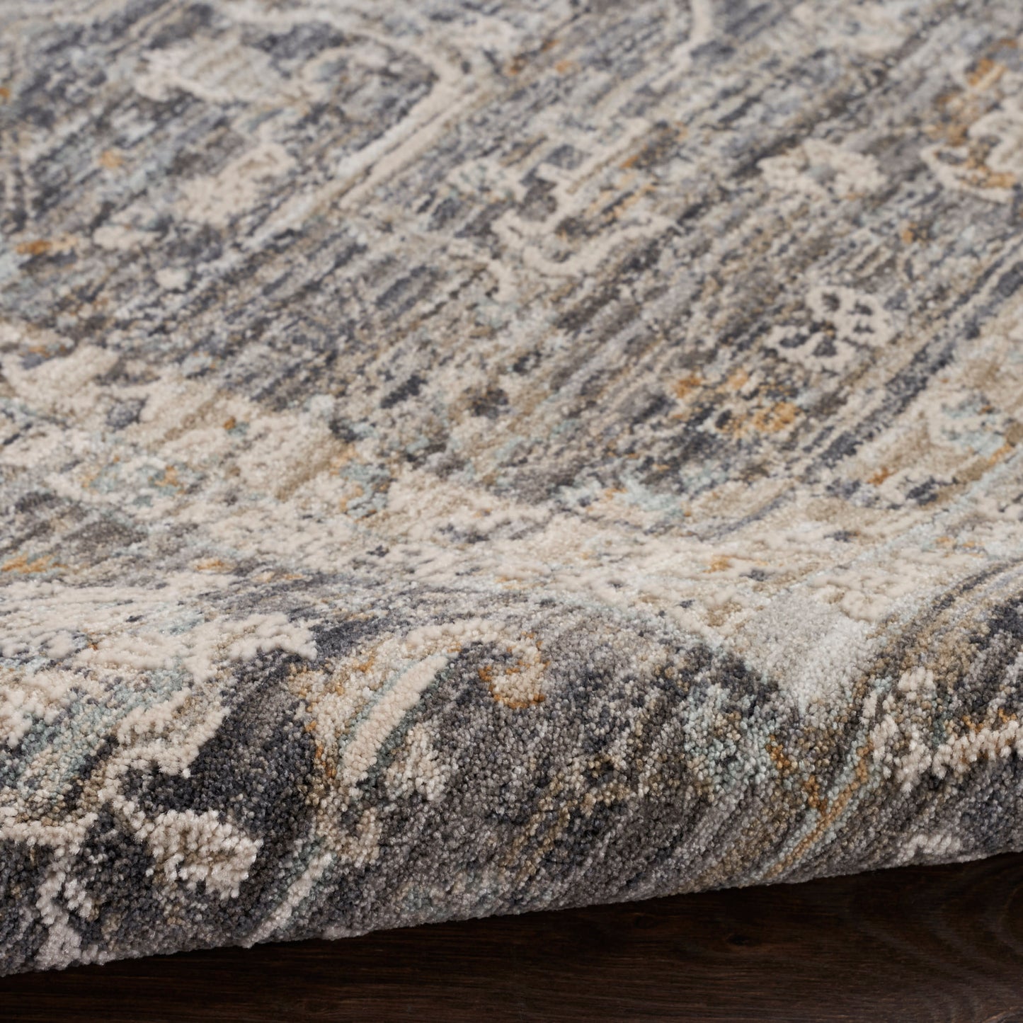 Distressed traditional runner rug with blue-gray, ivory and beige tones, hints of gold, soft textured pile and rolled edge, 8' long.