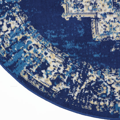 Round navy rug with abstract light-blue and beige distressed pattern.