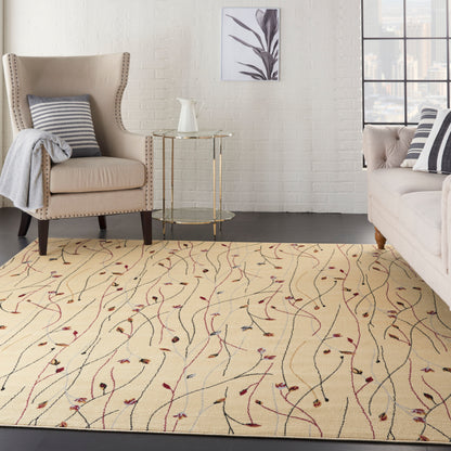Cream rug with red vines; beige wingback chair with nailhead trim, light sofa with striped cushions & a round glass side table visible around the rug.