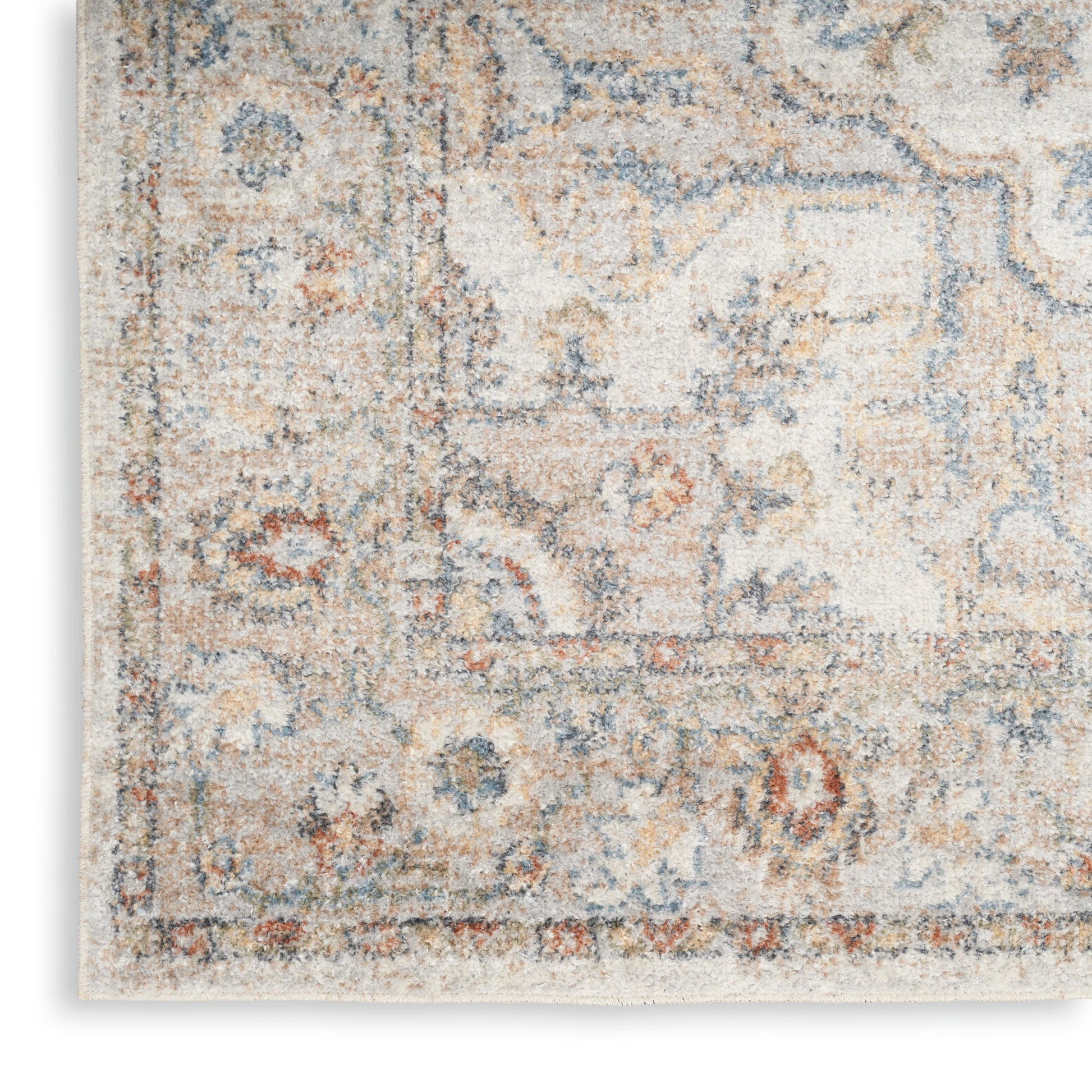 Cream distressed oriental area rug with blue-gray and tan accents; plush pile, vintage-inspired design.
